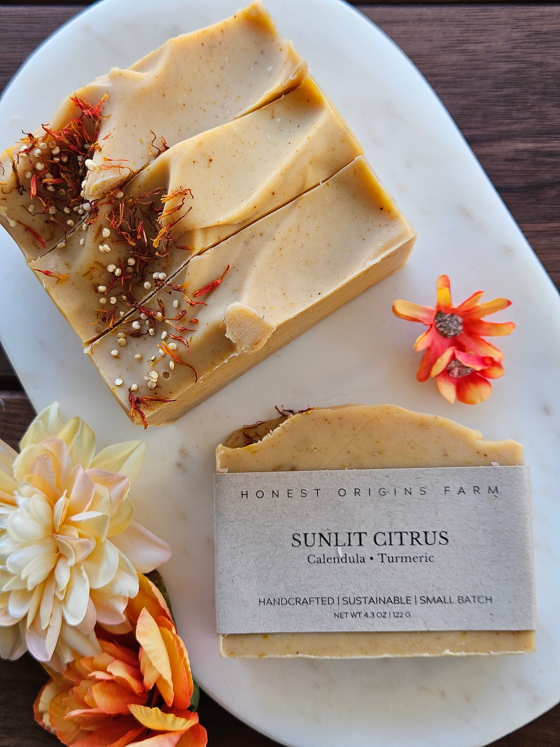 Sunlit Citrus Soap on a plate with flowers